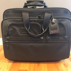Authentic Tumi roller laptop briefcase.